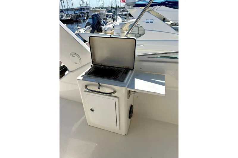 Slide: The Image of Control panel of a 2001 Pacific Mariner 65 Motoryacht with navigation and monitoring displays. - 30