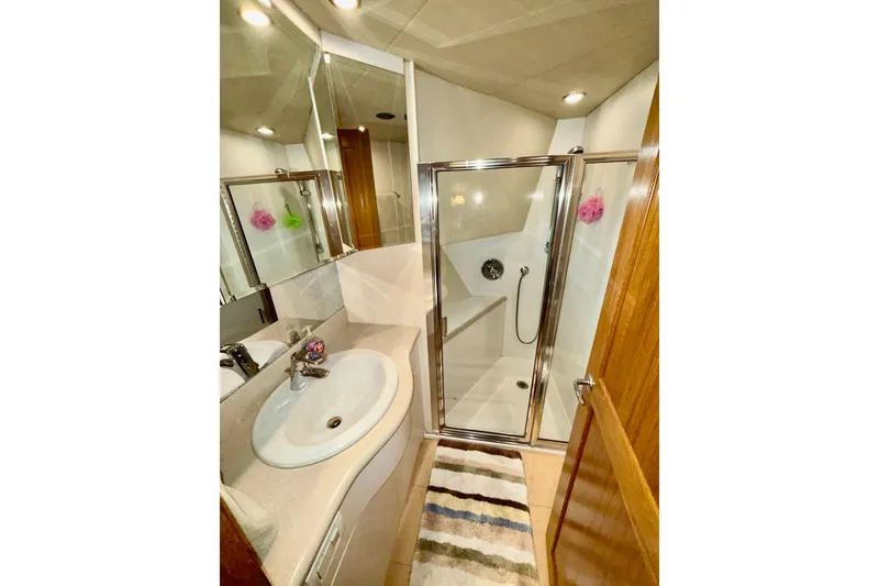 Slide: The Image of Bathroom interior of 2001 Pacific Mariner 65 Motoryacht with shower and sink. - 43