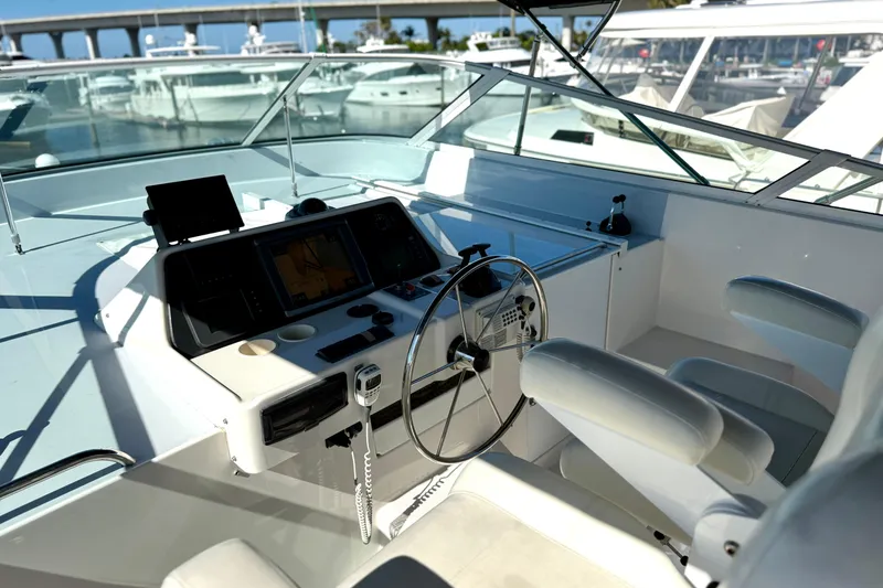 Slide: The Image of Cockpit of 2001 Pacific Mariner 65 Motoryacht with steering wheel and navigation equipment. - 45