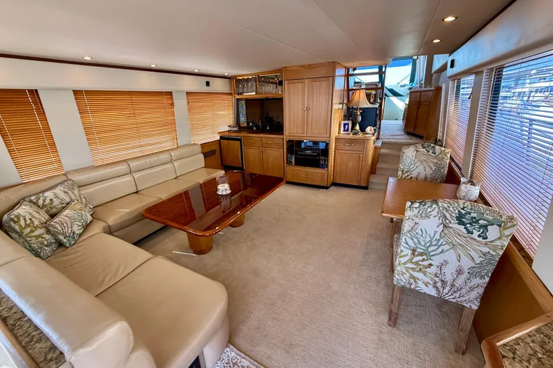 Slide: The Image of 2001 Pacific Mariner 65 Motoryacht docked under a vibrant rainbow. - 5