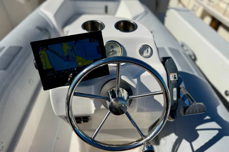 Slide: The Image of Steering wheel and navigation system on 2001 Pacific Mariner 65 Motoryacht. - 52