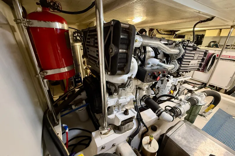 Slide: The Image of Engine room of a 2001 Pacific Mariner 65 Motoryacht, featuring a CAT marine engine. - 58
