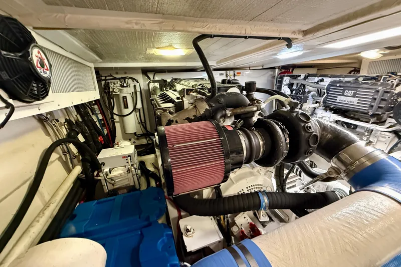 Slide: The Image of Engine room of a 2001 Pacific Mariner 65 Motoryacht, showcasing mechanical components and systems. - 59