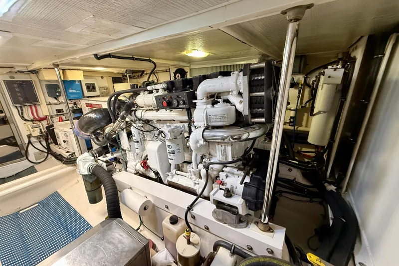 Slide: The Image of Engine room of a 2001 Pacific Mariner 65 Motoryacht, showcasing mechanical components and systems. - 60