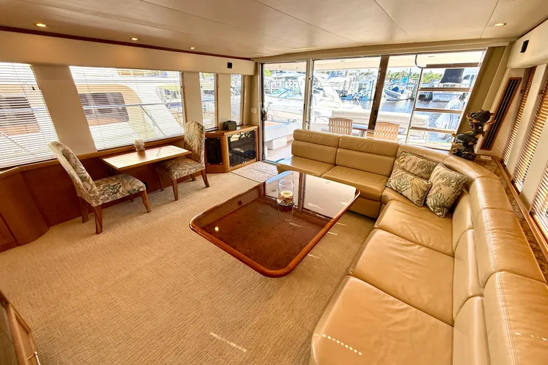 Slide: The Image of 2001 Pacific Mariner 65 Motoryacht anchored in clear blue ocean waters. - 7