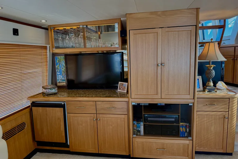 Slide: The Image of 2001 Pacific Mariner 65 Motoryacht on clear blue water under a sunny sky. - 8