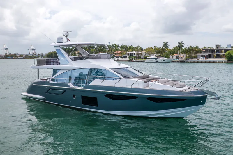 The Image of Azimut 60 Fly 2023 yacht on calm waters near coastline. - 0