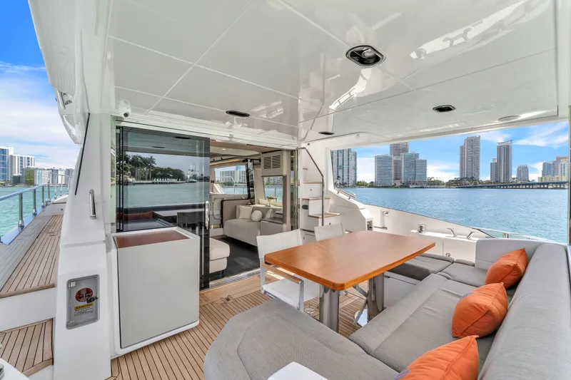 Slide: The Image of Luxurious Azimut 60 Fly yacht deck with city view, 2023 model. - 11