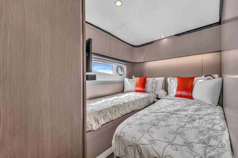 Slide: The Image of Luxurious cabin of Azimut 60 Fly 2023 with twin beds. - 28