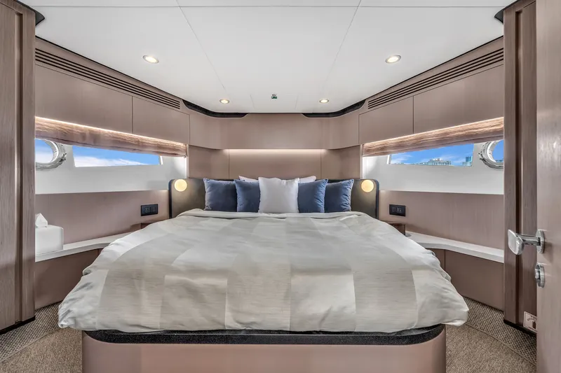 Slide: The Image of Luxurious bedroom on the Azimut 60 Fly yacht, model year 2023. - 31