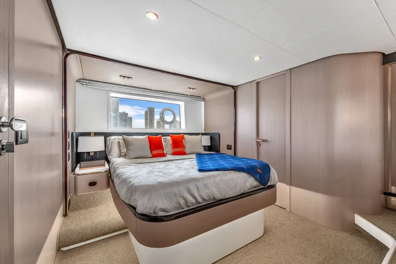 Slide: The Image of Luxurious bedroom on the Azimut 60 Fly yacht, model year 2023. - 34