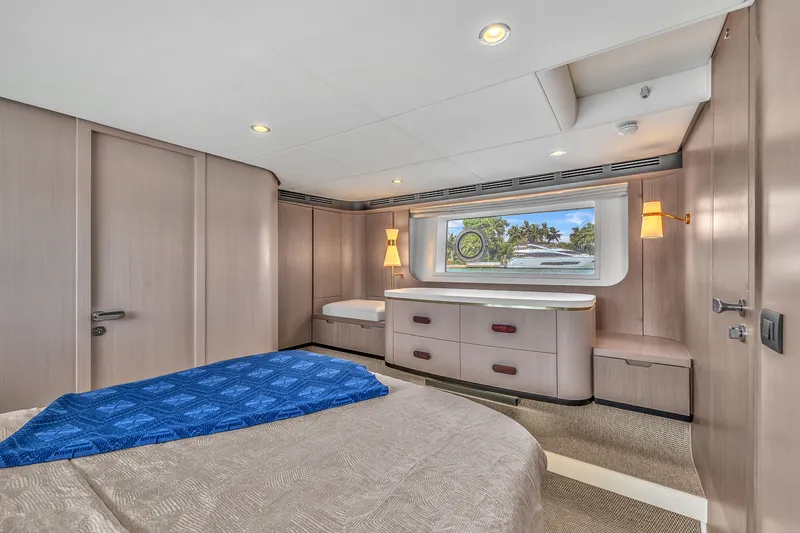 Slide: The Image of Luxurious bedroom on the Azimut 60 Fly yacht, model year 2023. - 37