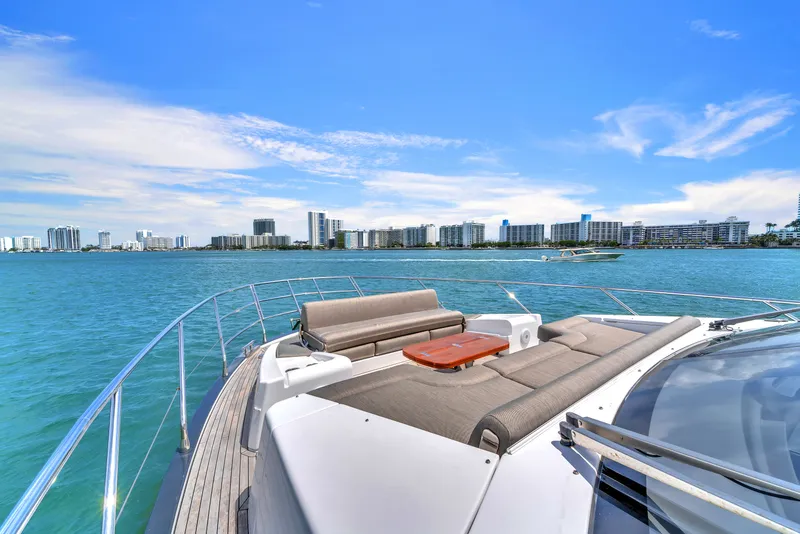 Slide: The Image of Azimut 60 Fly 2023 yacht with city skyline and blue sky. - 42