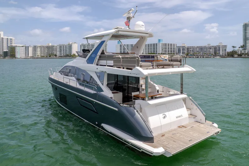 Slide: The Image of Azimut 60 Fly 2023 yacht on water with city skyline. - 6