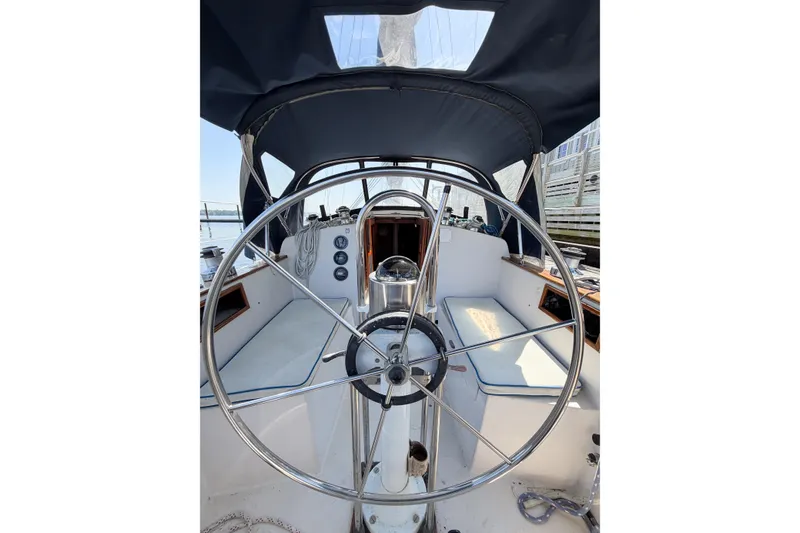 Slide: The Image of Cockpit of a 1987 Bayfield 36 sailboat with a large steering wheel. - 15
