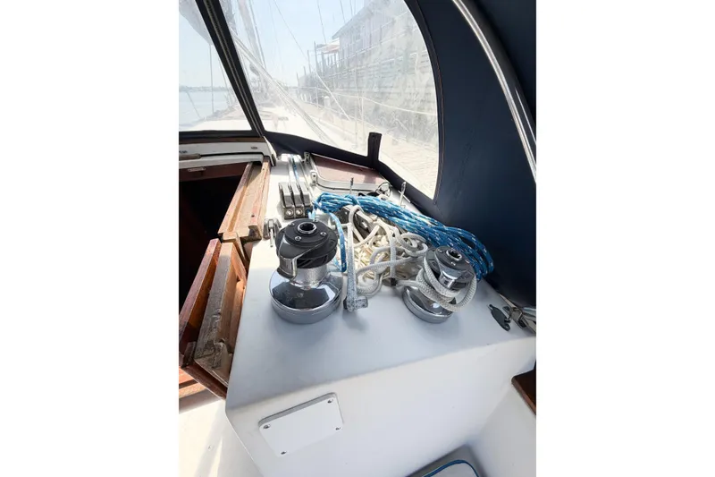 Slide: The Image of Cockpit of 1987 Bayfield 36 sailboat with winches and ropes. - 22