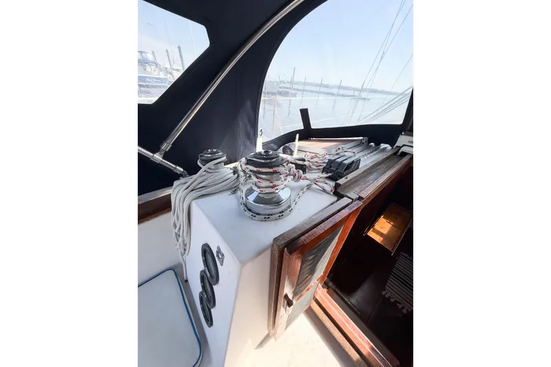 Slide: The Image of Cockpit view of 1987 Bayfield 36 sailboat with winch and ropes. - 23