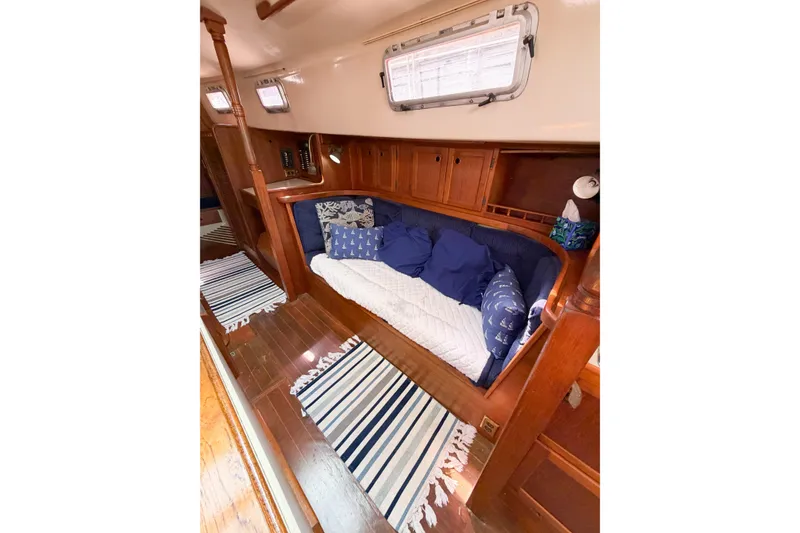Slide: The Image of Cozy cabin interior of 1987 Bayfield 36 sailboat with wooden finish and nautical decor. - 41