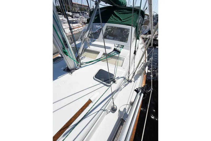 Slide: The Image of 2002 Beneteau Oceanis 42CC sailboat deck with green canopy and rigging. - 17