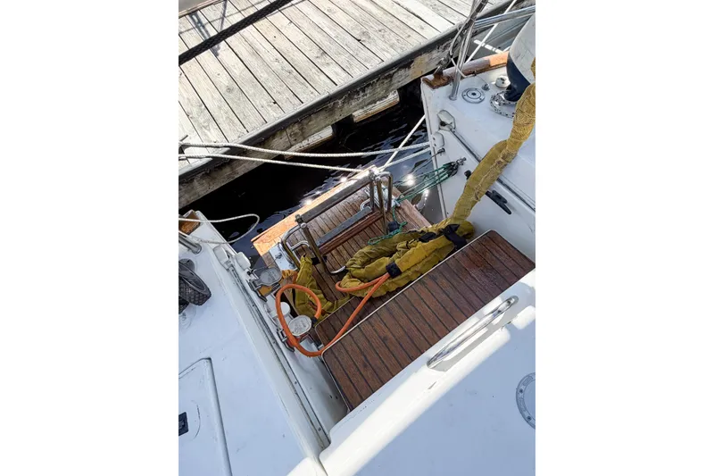 Slide: The Image of Cockpit view of 2002 Beneteau Oceanis 42CC sailboat docked at a marina. - 19