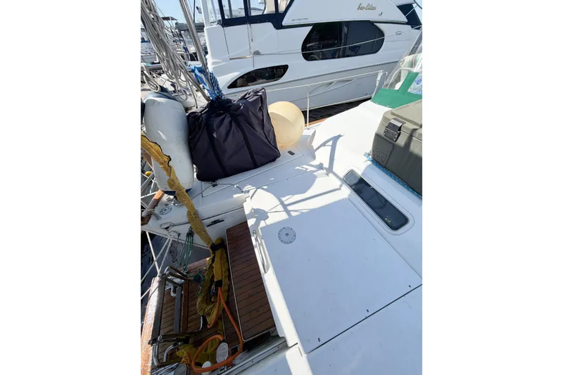 Slide: The Image of 2002 Beneteau Oceanis 42CC sailboat deck with equipment and storage. - 23