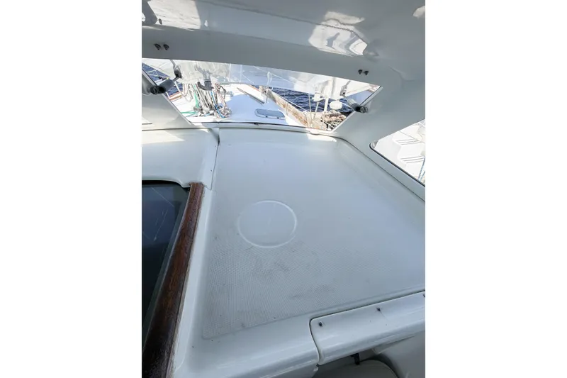 Slide: The Image of 2002 Beneteau Oceanis 42CC yacht deck with clear view of marina surroundings. - 37