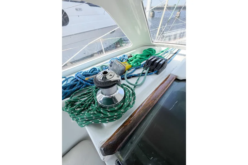 Slide: The Image of Deck view of 2002 Beneteau Oceanis 42CC sailboat with ropes and winch. - 38