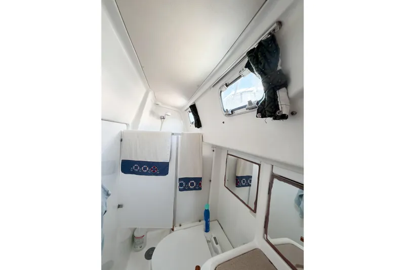 Slide: The Image of Interior of 2002 Beneteau Oceanis 42CC yacht bathroom with window and mirrors. - 55