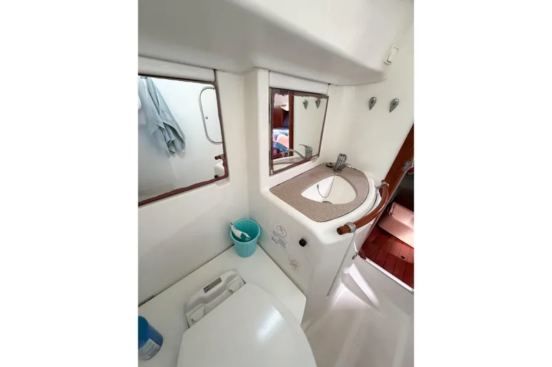 Slide: The Image of Bathroom interior of 2002 Beneteau Oceanis 42CC yacht, featuring sink and mirror. - 57