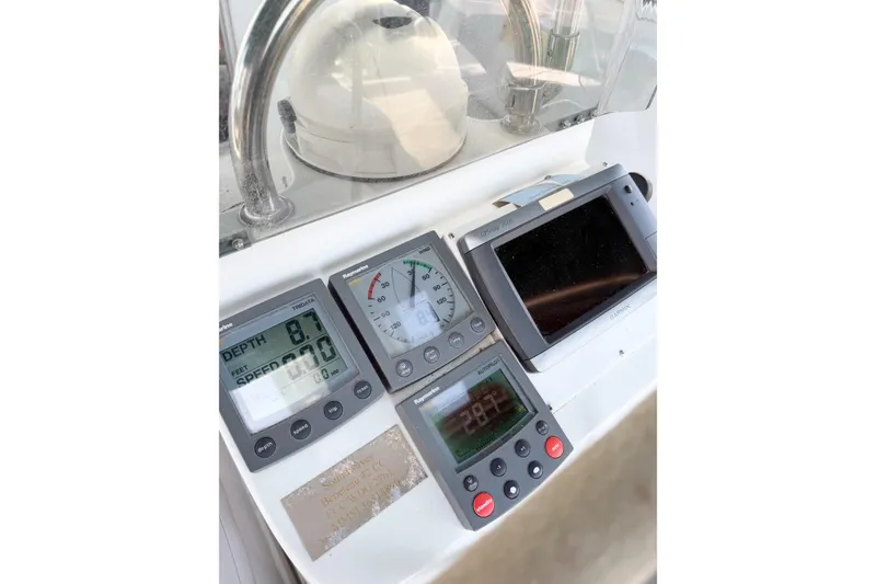Slide: The Image of Beneteau Oceanis 42CC 2002 yacht dashboard with navigation instruments and depth gauge. - 75