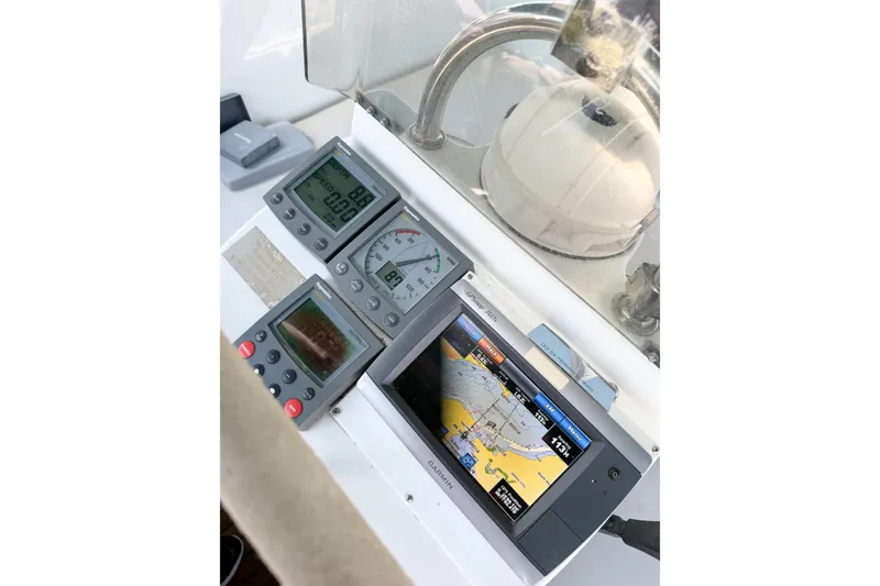 Slide: The Image of Navigation instruments on a 2002 Beneteau Oceanis 42CC yacht dashboard. - 76