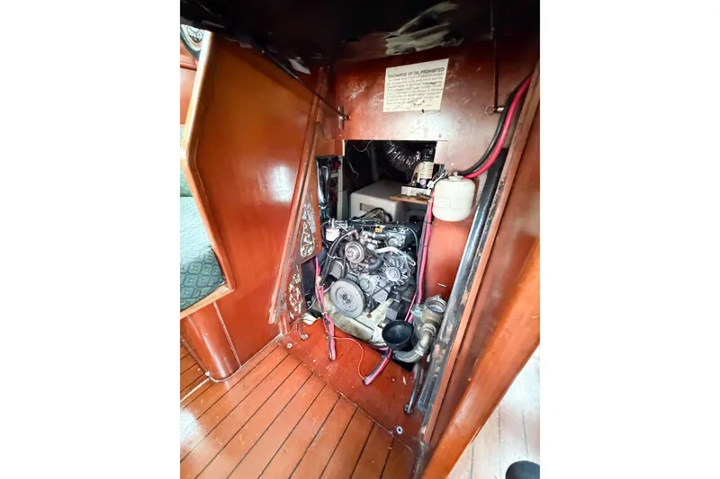 Slide: The Image of Engine compartment of 2002 Beneteau Oceanis 42CC sailboat, showcasing mechanical components. - 79