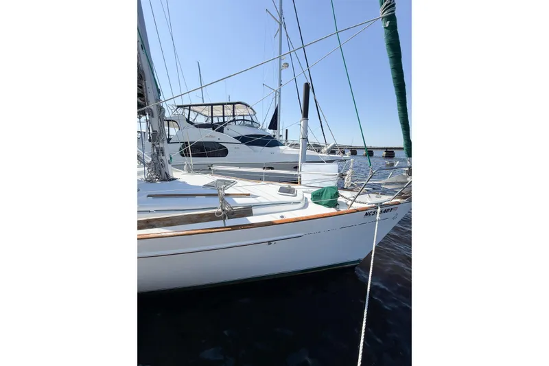 Slide: The Image of Sailboat Beneteau Oceanis 42CC, 2002 model, docked at marina on a sunny day. - 8