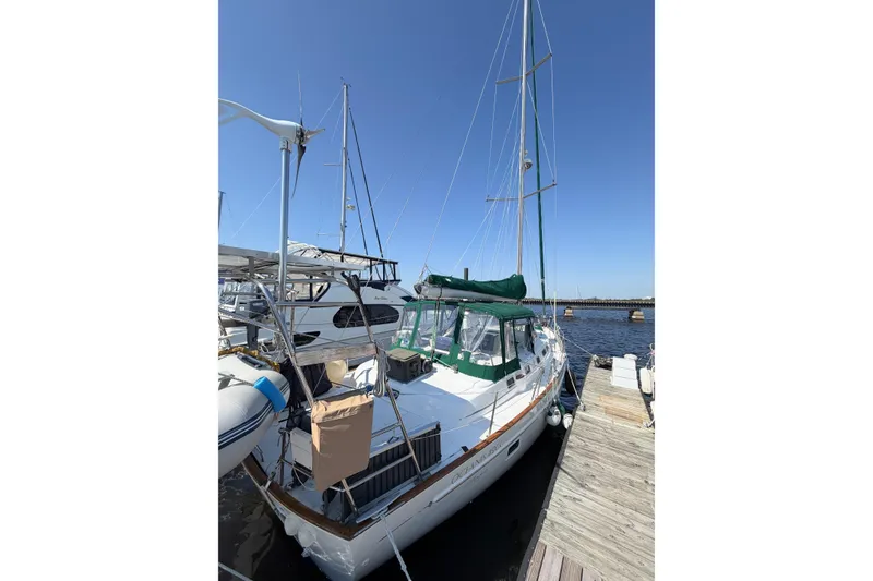 Slide: The Image of 2002 Beneteau Oceanis 42CC sailboat docked at marina under clear blue sky. - 9