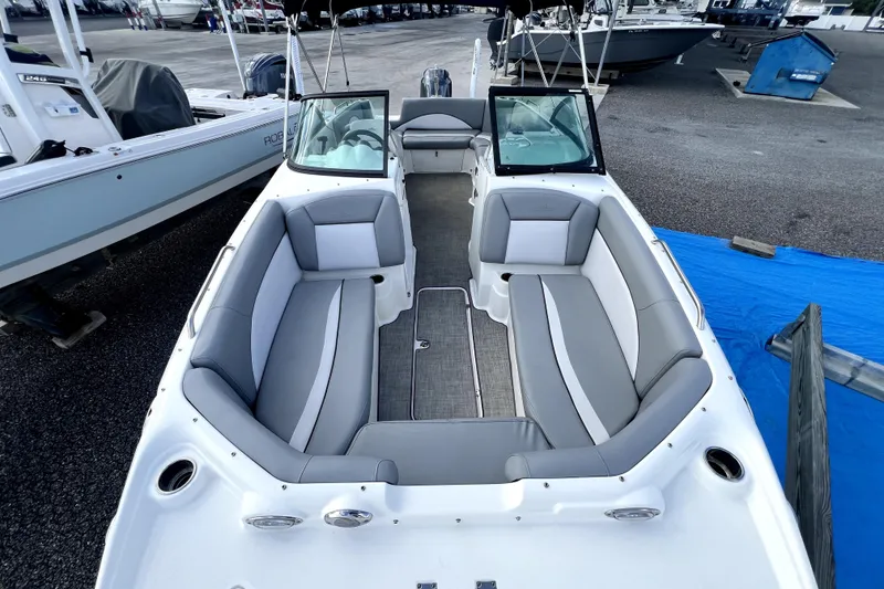 Slide: The Image of 2022 NauticStar 223DC Sport Deck boat with spacious seating and sleek design. - 32