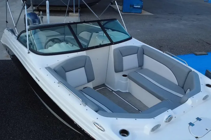 Slide: The Image of 2022 NauticStar 223DC Sport Deck boat with spacious seating and sleek design. - 35