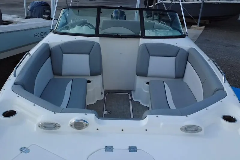 Slide: The Image of 2022 NauticStar 223DC Sport Deck boat with spacious seating and modern design. - 36