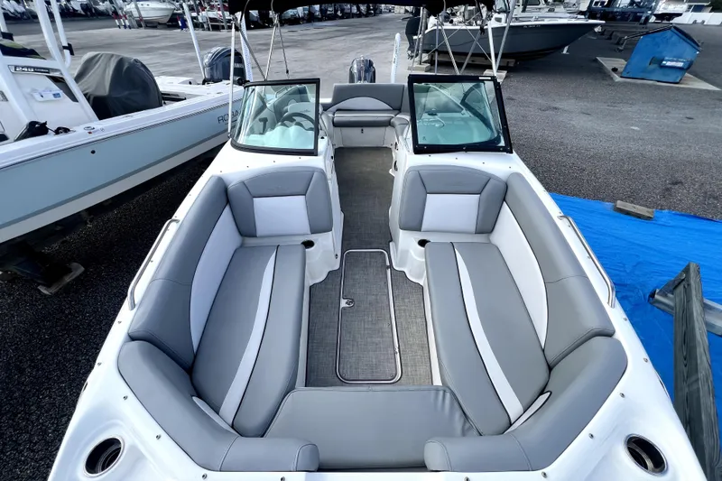 Slide: The Image of 2022 NauticStar 223DC Sport Deck boat with spacious seating and modern design. - 37