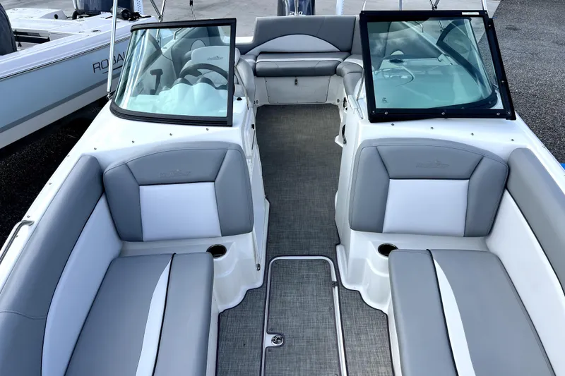 Slide: The Image of 2022 NauticStar 223DC Sport Deck boat interior with gray and white seating. - 38