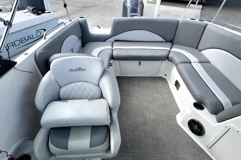 Slide: The Image of 2022 NauticStar 223DC Sport Deck boat interior with gray seating and modern design. - 41