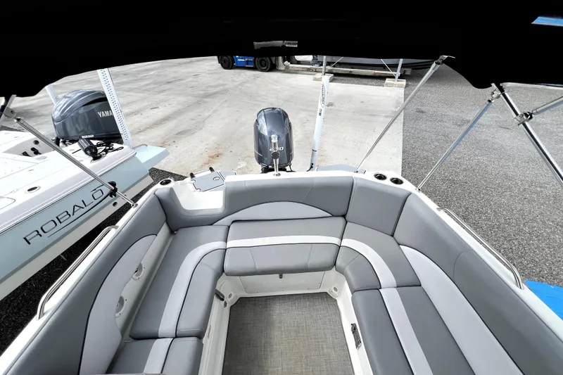 Slide: The Image of 2022 NauticStar 223DC Sport Deck boat with spacious seating and Yamaha engine. - 42