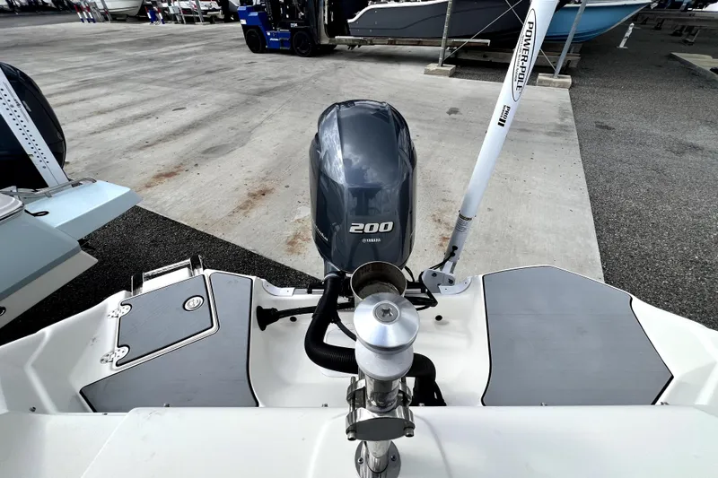 Slide: The Image of 2022 NauticStar 223DC Sport Deck with Yamaha 200 engine, docked at a marina. - 43