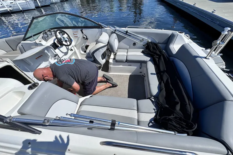 Slide: The Image of 2022 NauticStar 223DC Sport Deck boat with Yamaha 200 engine, parked outdoors. - 6