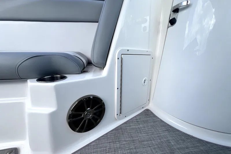 Slide: The Image of Interior of 2022 NauticStar 223DC Sport Deck with speaker and storage compartment. - 61