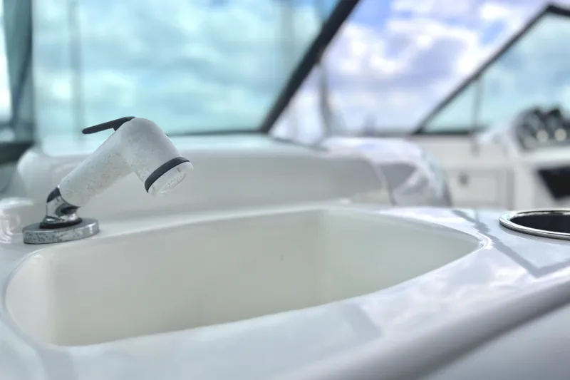 Slide: The Image of 2022 NauticStar 223DC Sport Deck boat sink and faucet detail. - 64