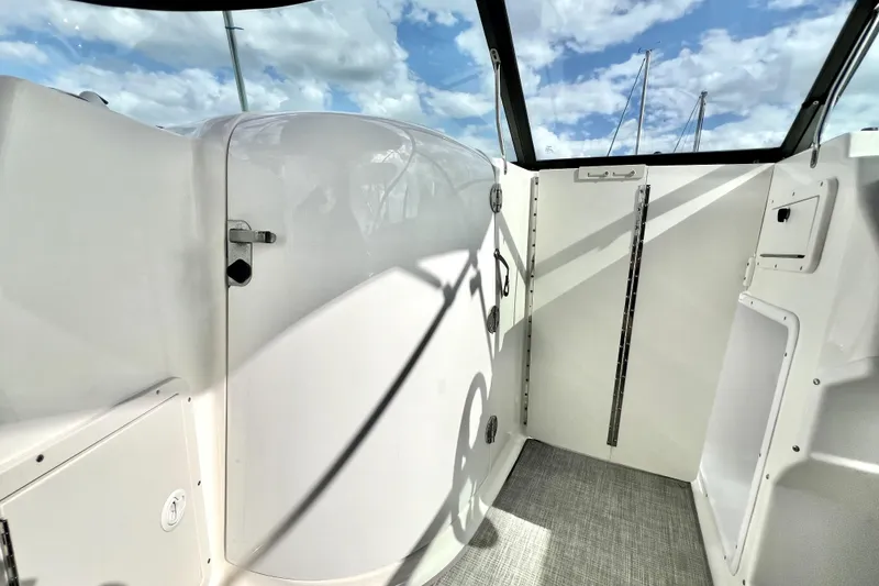 Slide: The Image of 2022 NauticStar 223DC Sport Deck interior with sleek design and modern features. - 65