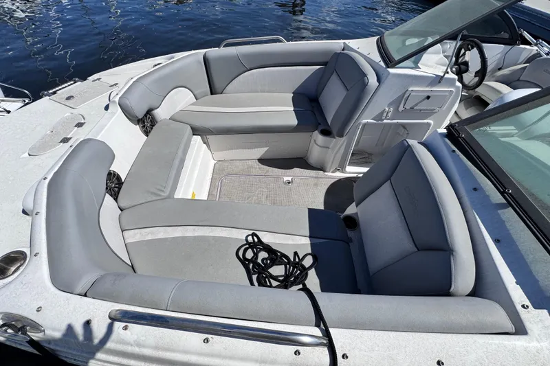 Slide: The Image of Close-up of a 2022 NauticStar 223DC Sport Deck boat propeller on gravel. - 7