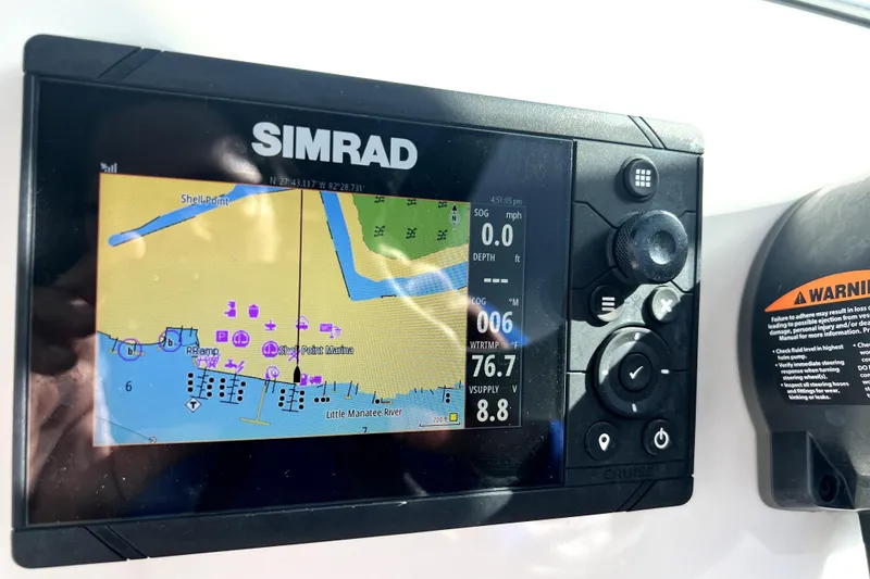 Slide: The Image of Simrad navigation display on 2022 NauticStar 223DC Sport Deck boat. - 75