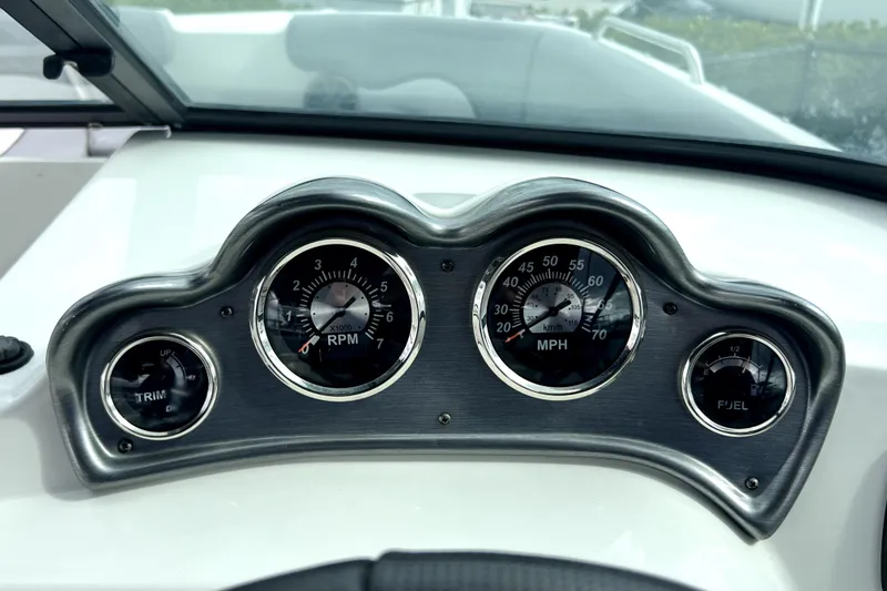 Slide: The Image of Dashboard of 2022 NauticStar 223DC Sport Deck boat with gauges for RPM, speed, trim, and fuel. - 76