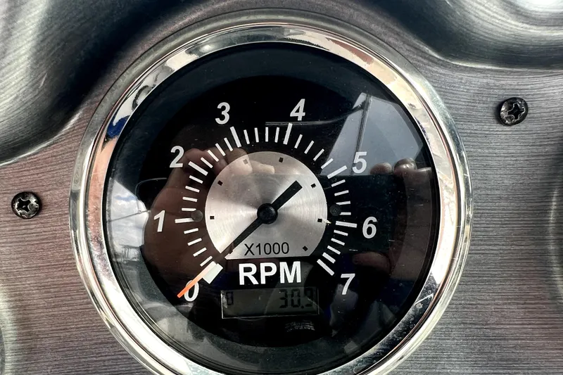 Slide: The Image of Close-up of a NauticStar 223DC Sport Deck 2022 RPM gauge. - 77